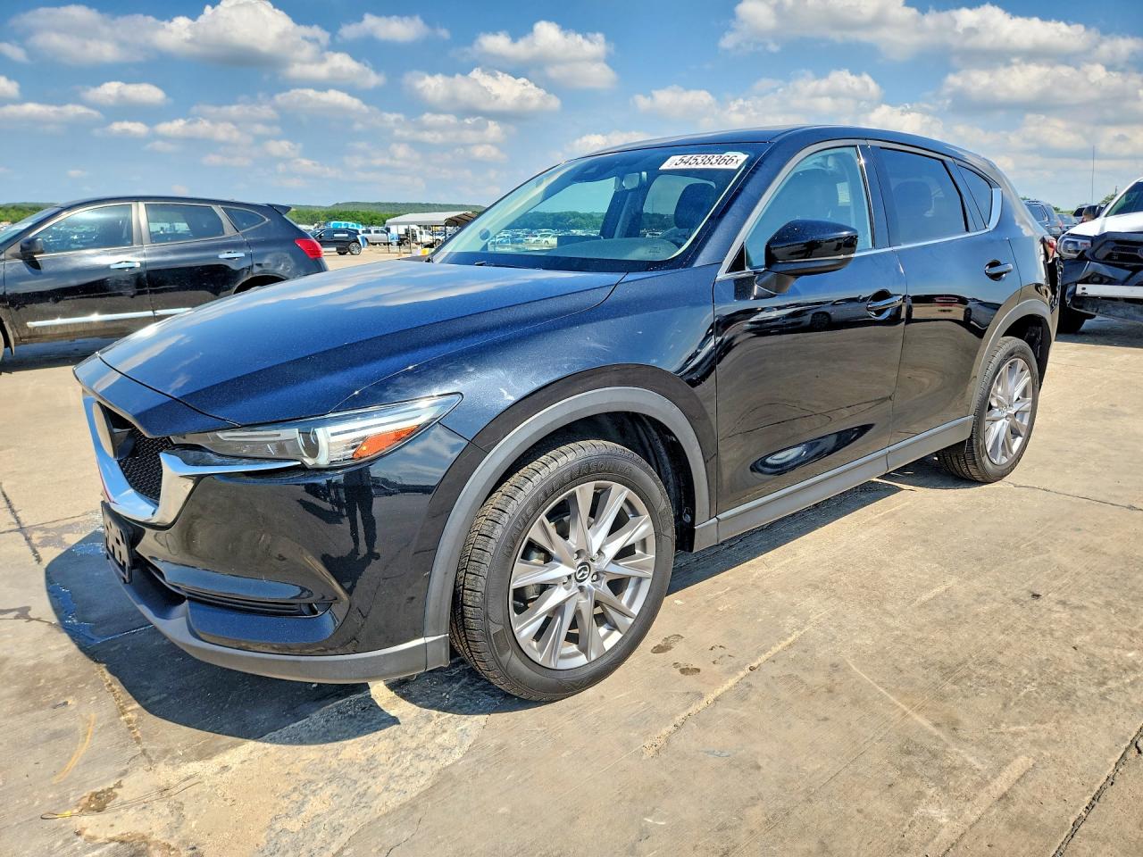 2021 Mazda CX-5 Grand Touring, VIN JM3KFADM3M1326666 — Rear end