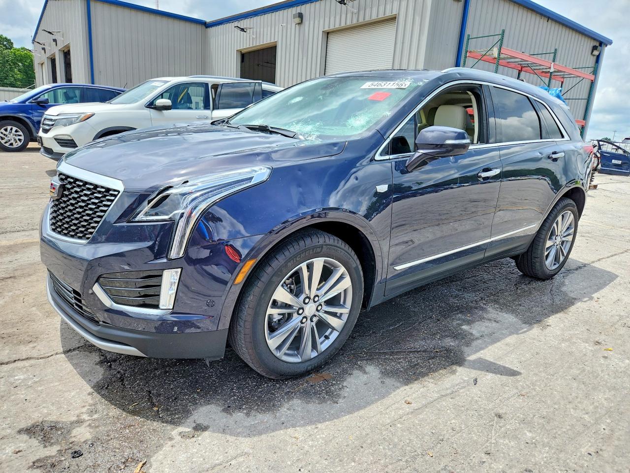 2025 Cadillac XT5 AWD Premium Luxury, VIN 1GYKNDR49SZ148454 — Hail