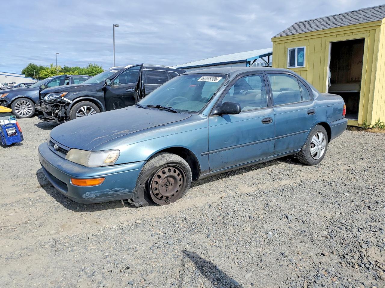 1995 Toyota Corolla DX, VIN 1NXAE09B3SZ283236 — Front end