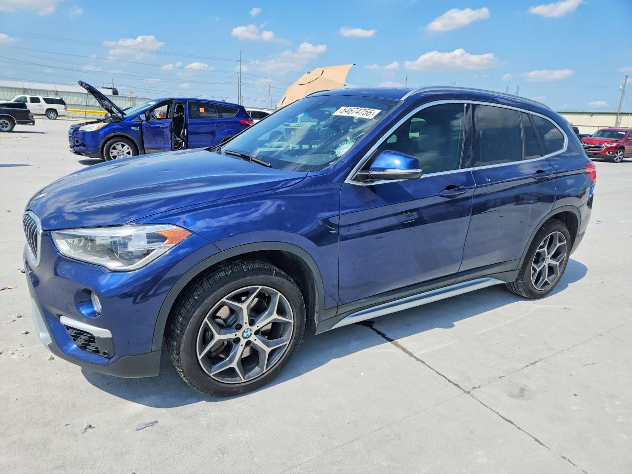 2019 BMW X1 xDrive28i, VIN WBXHT3C54K5L37167 — Hail