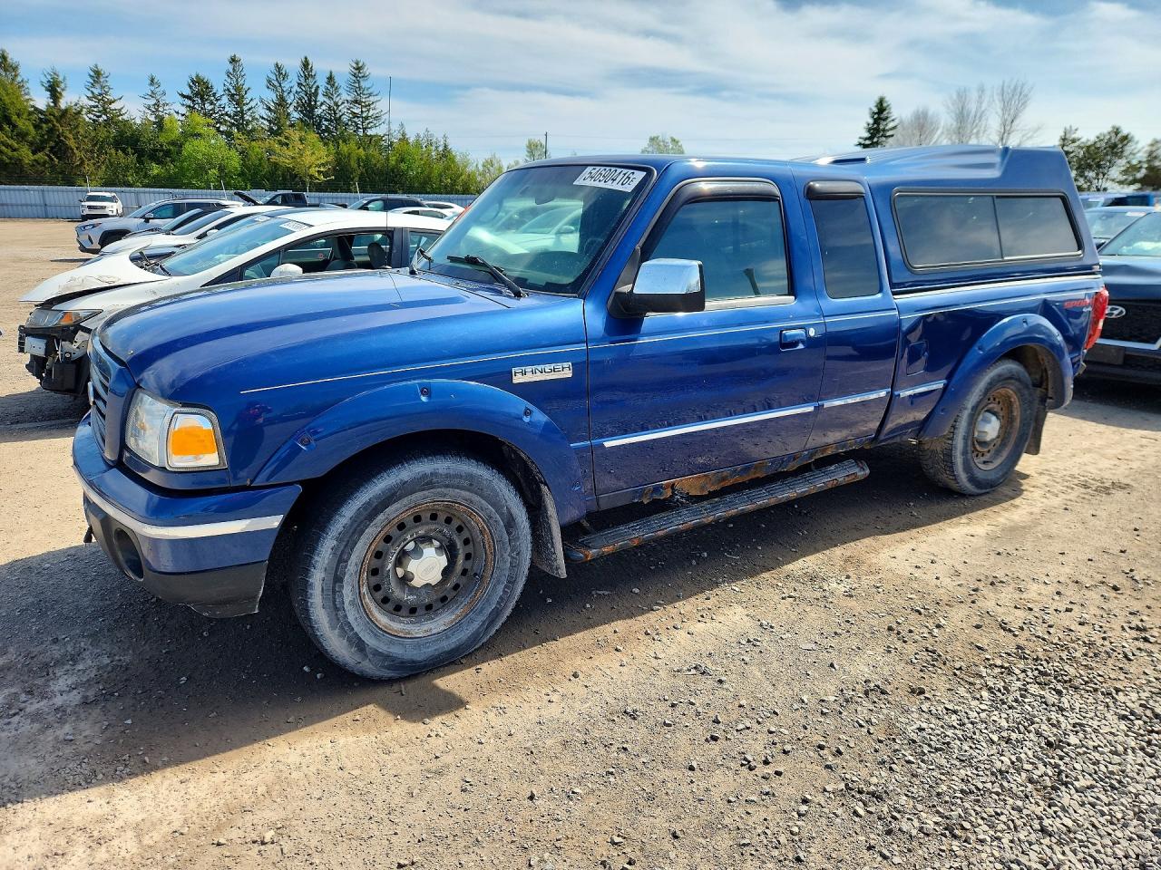 2009 Ford Ranger XLT, VIN 1FTZR45E79PA55350 — Side
