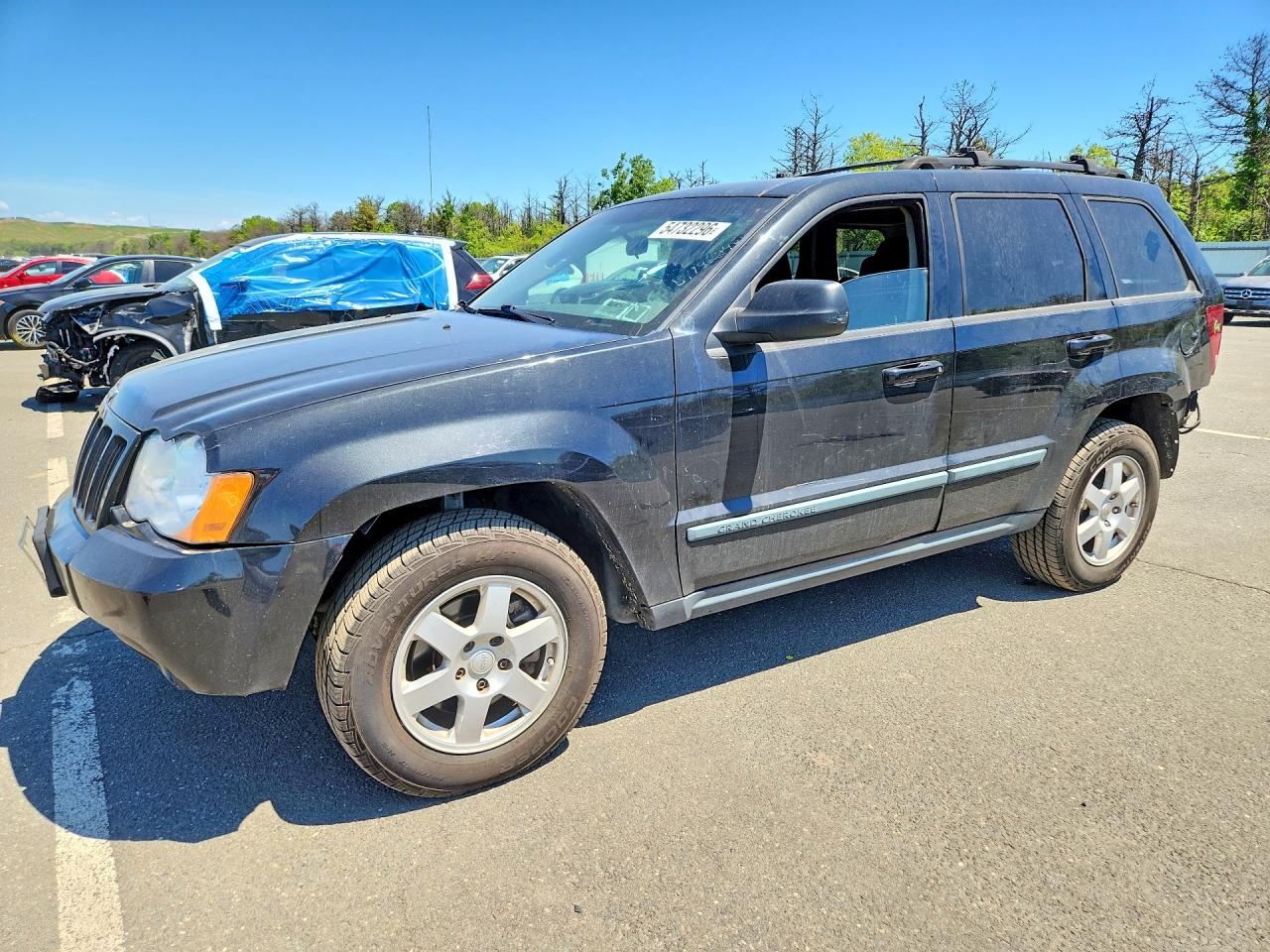 2009 Jeep Grand Cherokee Laredo, VIN 1J8GR48K59C538148 — Rear end