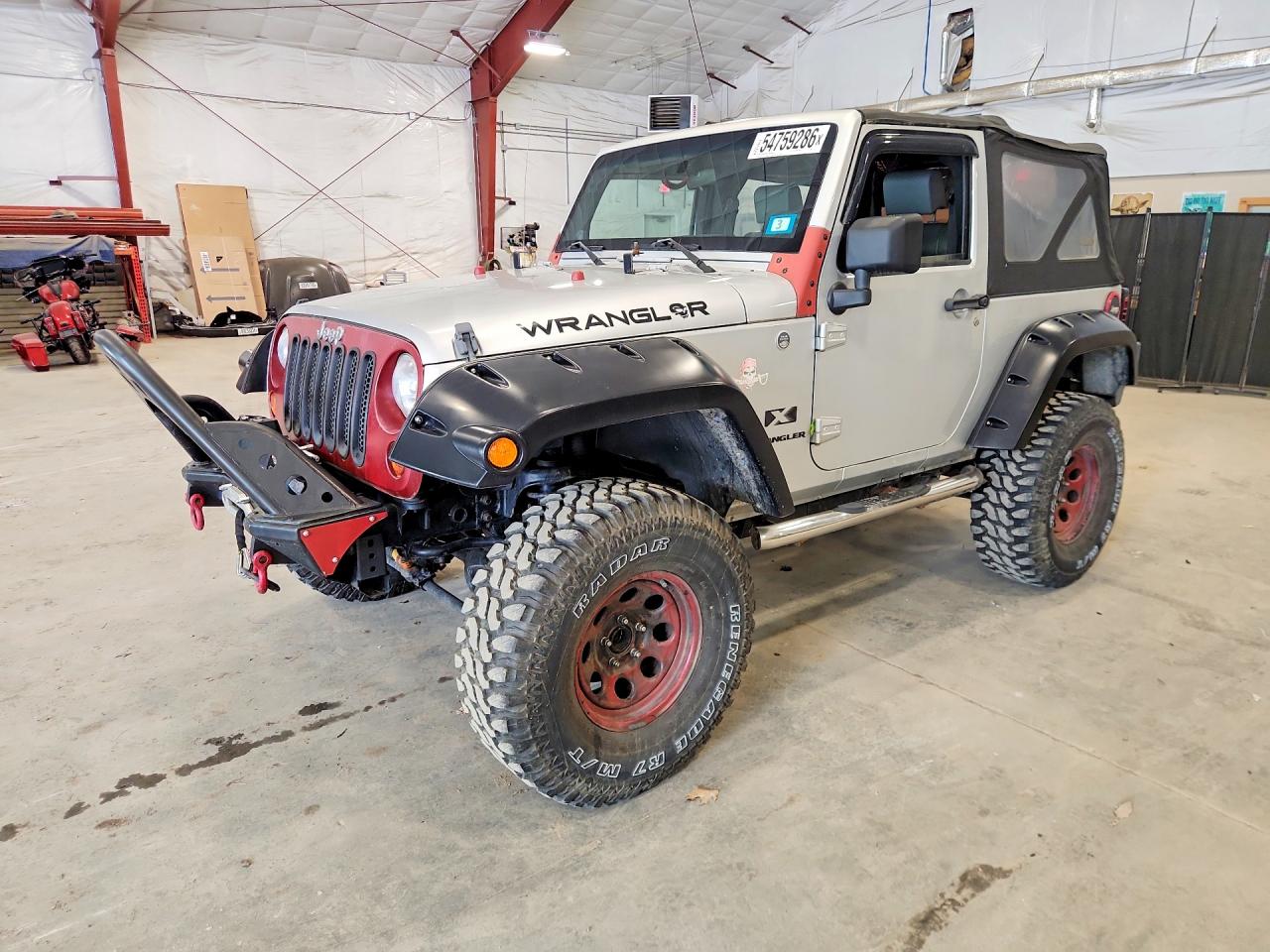 2009 Jeep Wrangler X, VIN 1J4FA24199L727570 — Minor dents and scratches