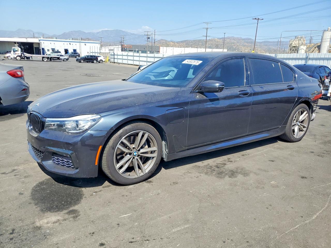 2018 BMW 7 Series 740e xDrive, VIN WBA7J2C5XJG938446 — Rear end