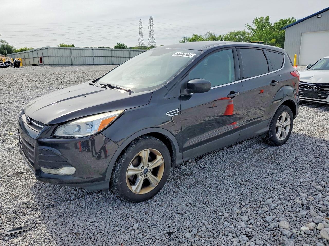 2015 Ford Escape SE, VIN 1FMCU0GX3FUC33632 — Side