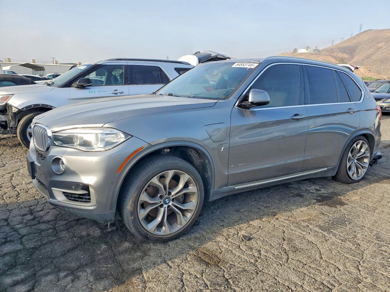 2018 BMW X5 xDrive40e, VIN 5UXKT0C52J0W04088 — Side