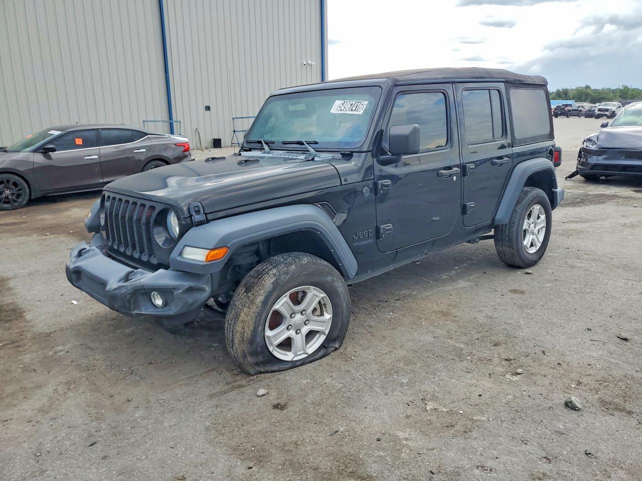 2022 Jeep Wrangler Unlimited Sport S, VIN 1C4HJXDG6NW165068 — Side