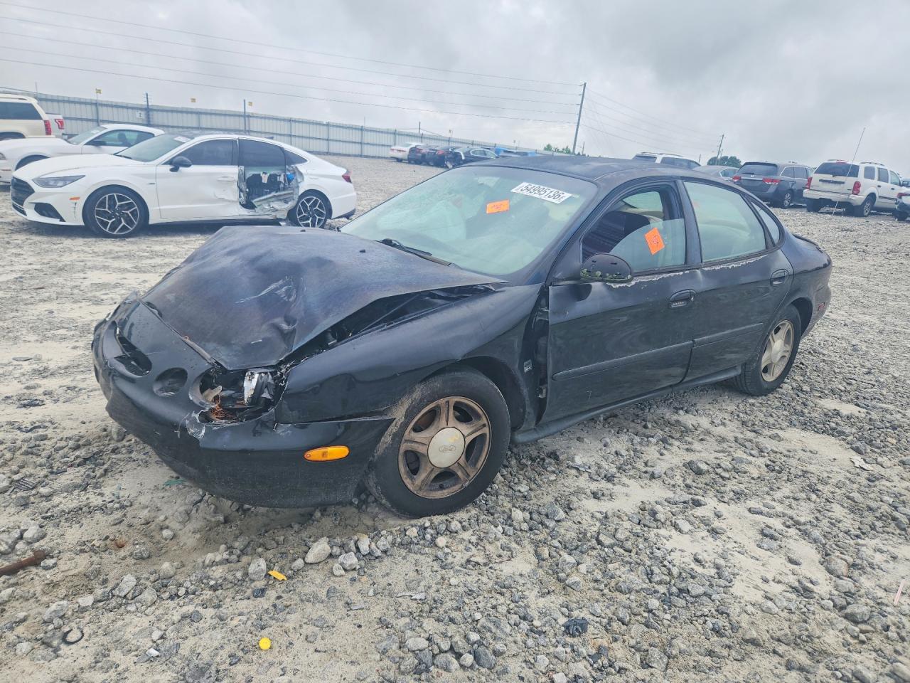 1999 Ford Taurus SE, VIN 1FAFP53S2XA169429 — Front end