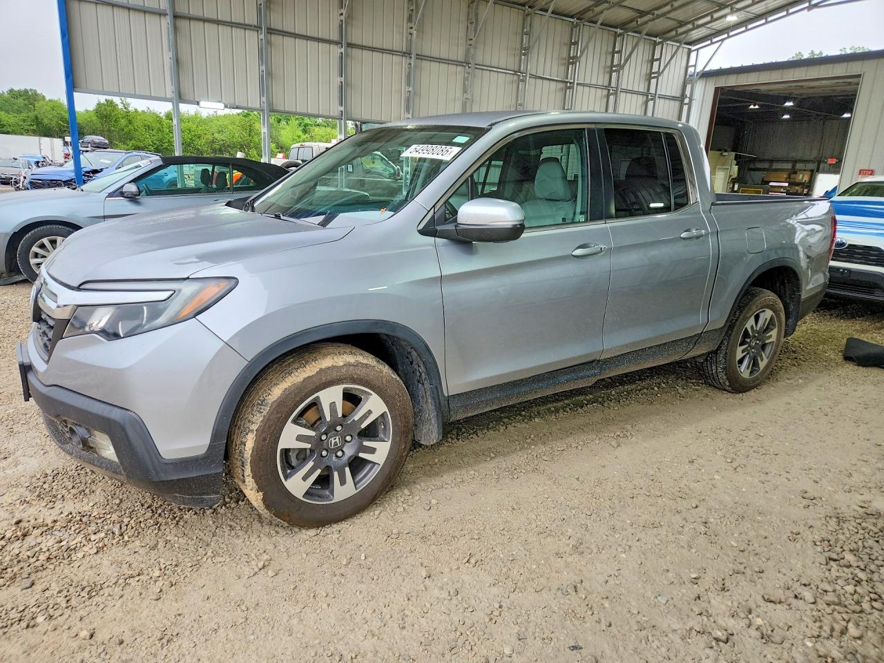 2017 Honda Ridgeline RTL, VIN 5FPYK3F57HB032126 — Undercarriage