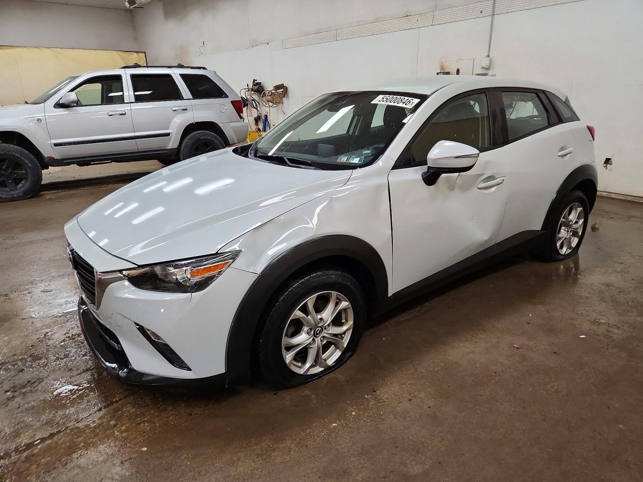 2019 Mazda CX-3 Sport, VIN JM1DKFB78K1459833 — Side