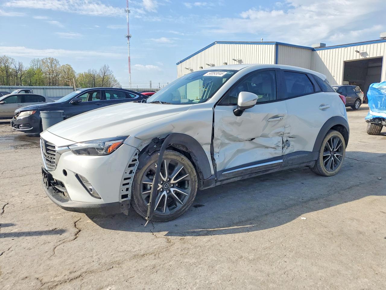 2016 Mazda CX-3 Grand Touring, VIN JM1DKBD78G0124008 — Side