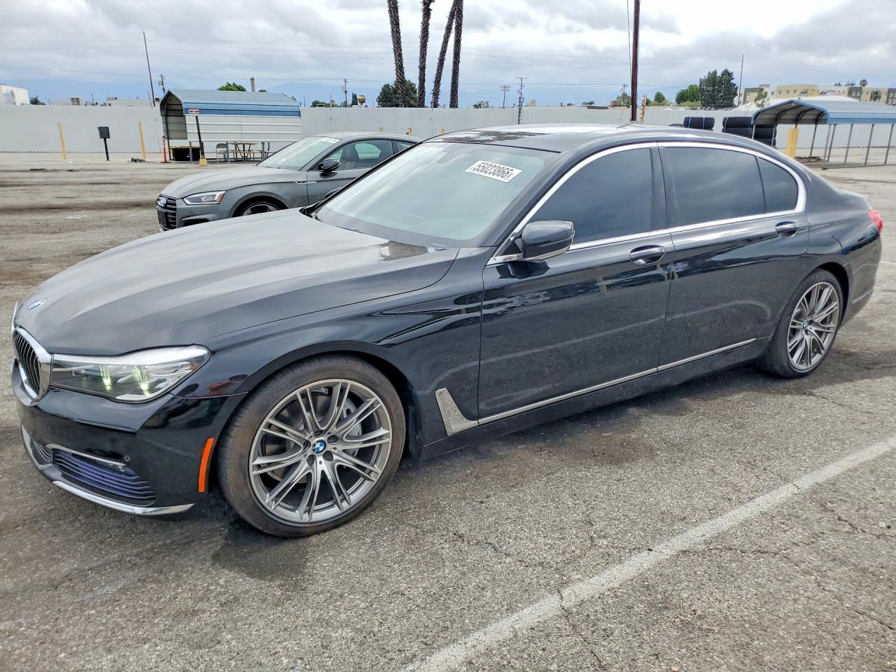 2016 BMW 7 Series 740i, VIN WBA7E2C52GG738741 — Side