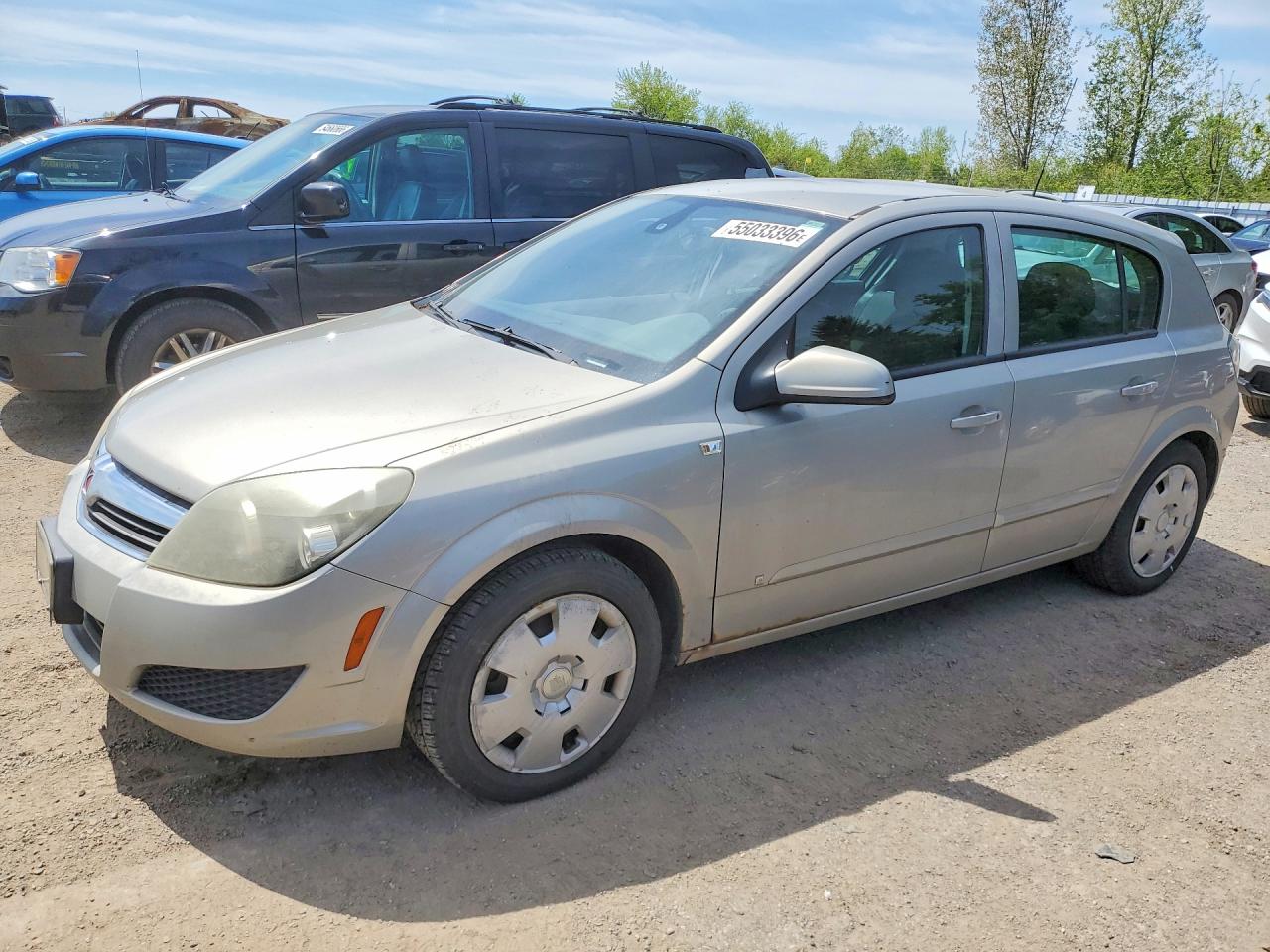2009 Saturn Astra XE, VIN W08AR671795018497 — Side