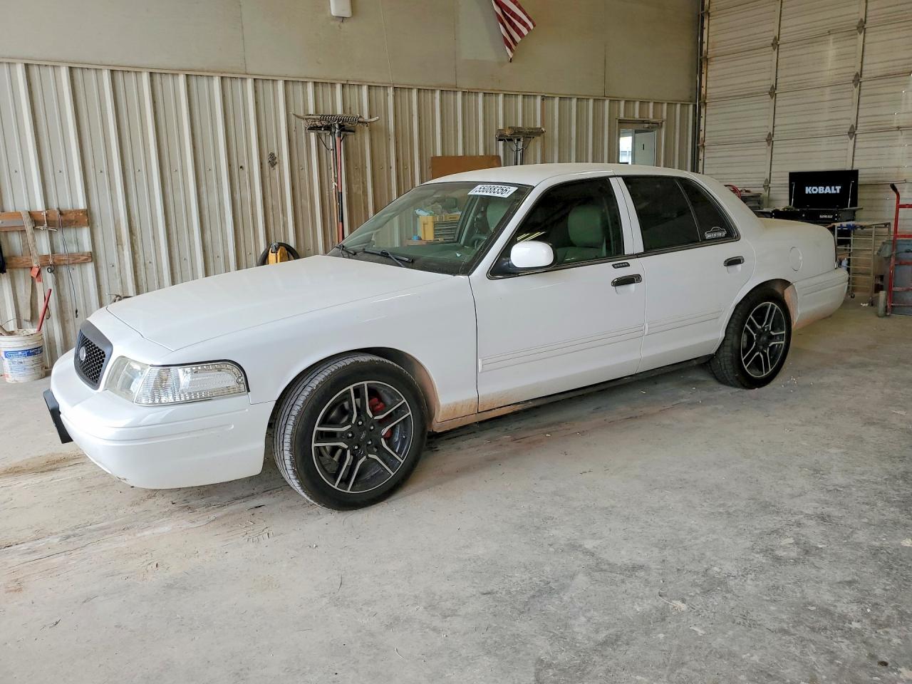 2011 Ford Crown Victoria LX, VIN 2FABP7EV6BX154529 — Side