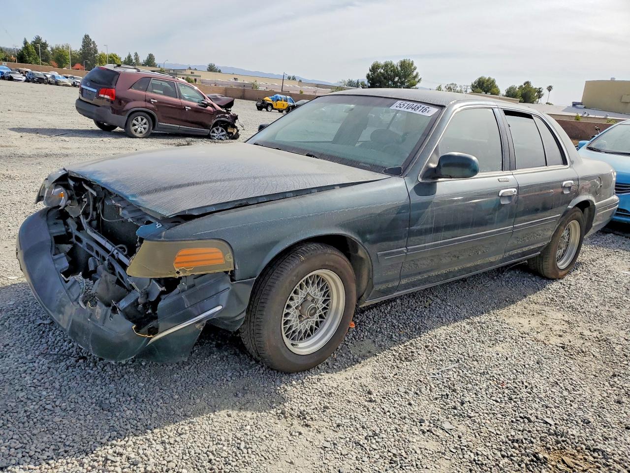 1998 Ford Crown Victoria LX, VIN 2FAFP74W1WX172857 — Front end