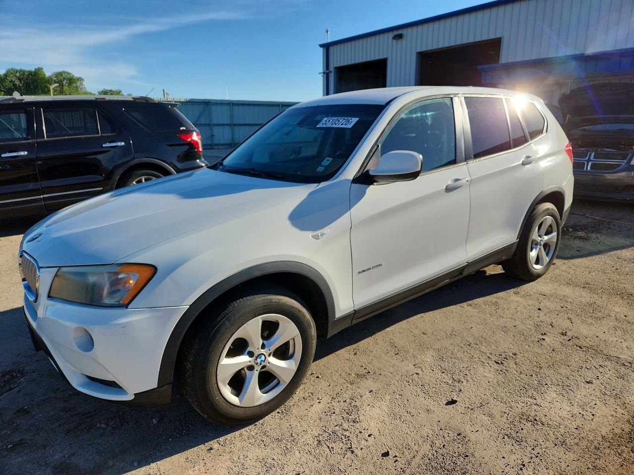 2011 BMW X3 28i, VIN 5UXWX5C54BL702932 — Hail