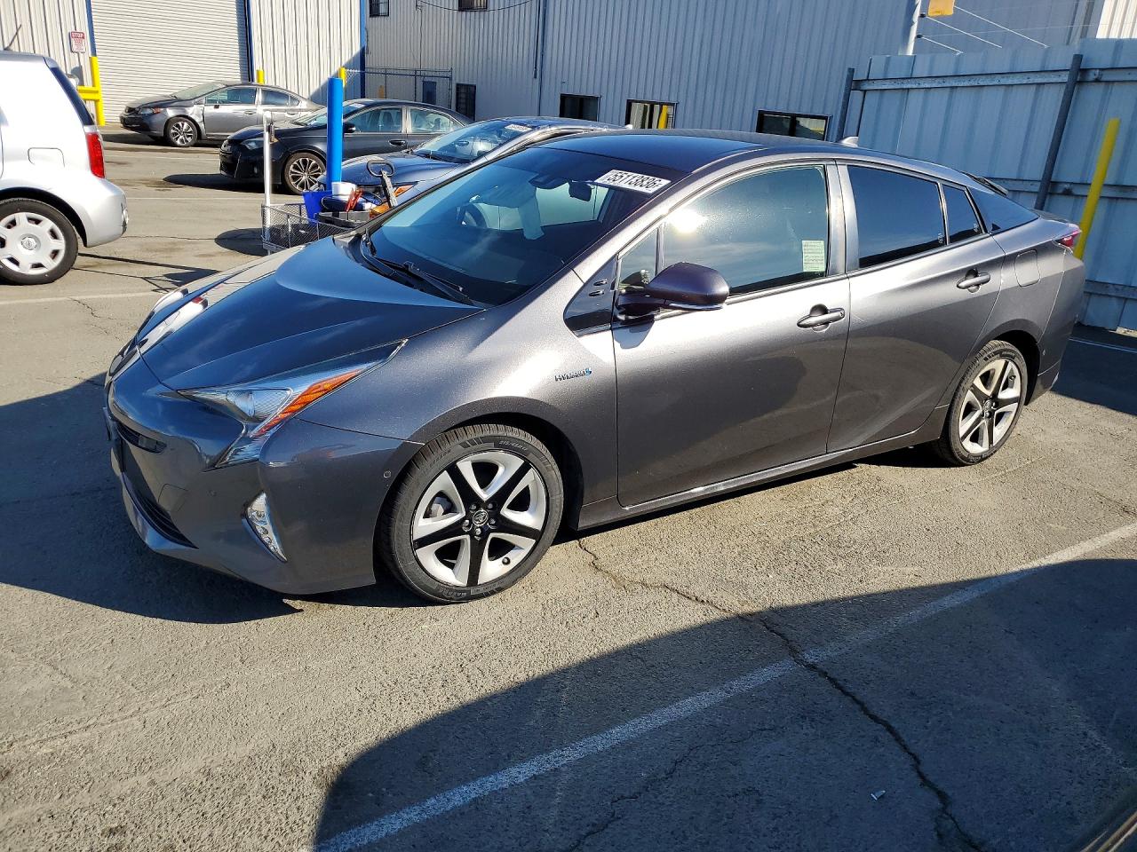 2018 Toyota Prius Three, VIN JTDKARFU8J3065912 — Side