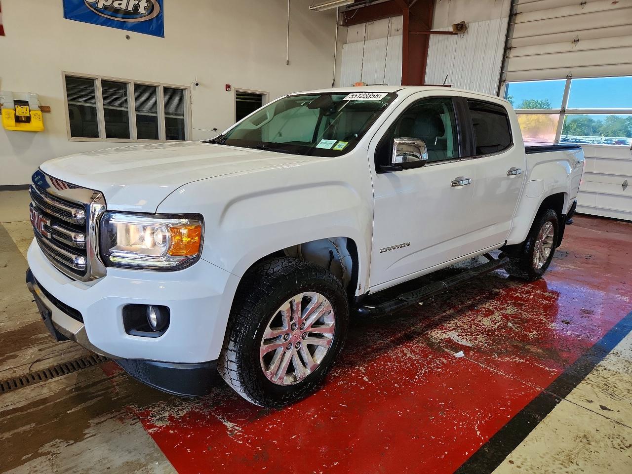 2018 GMC Canyon 4WD SLT, VIN 1GTG6DEN2J1205114 — Hail