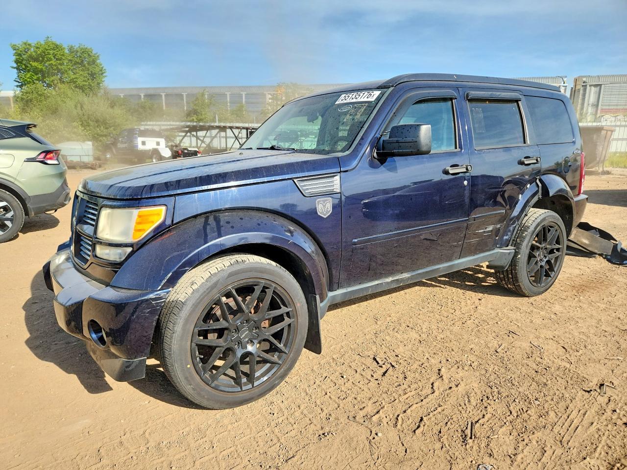 2011 Dodge Nitro Heat, VIN 1D4PU4GK6BW514309 — Side