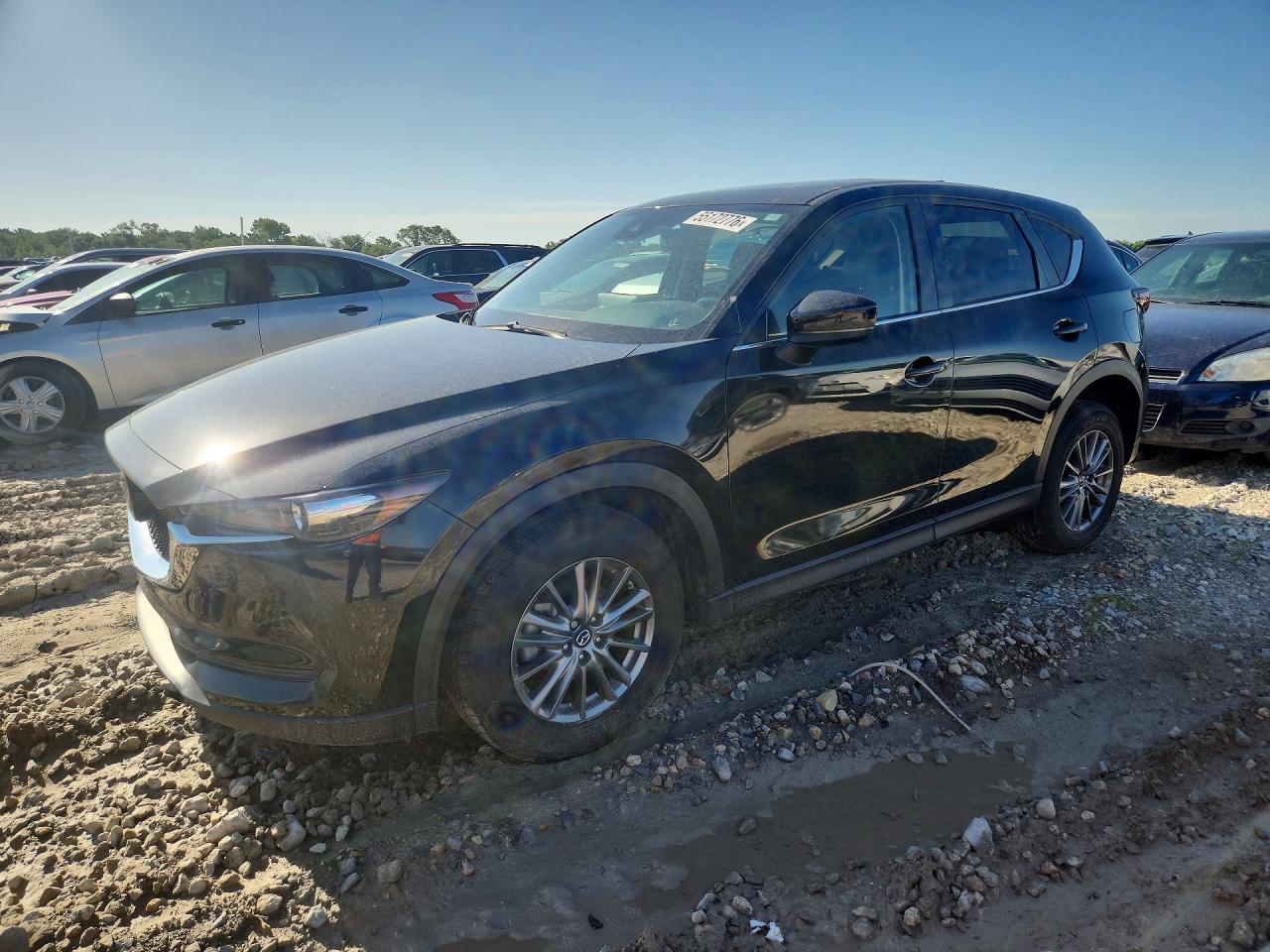 2021 Mazda CX-5 Touring, VIN JM3KFBCM8M1408058 — Град