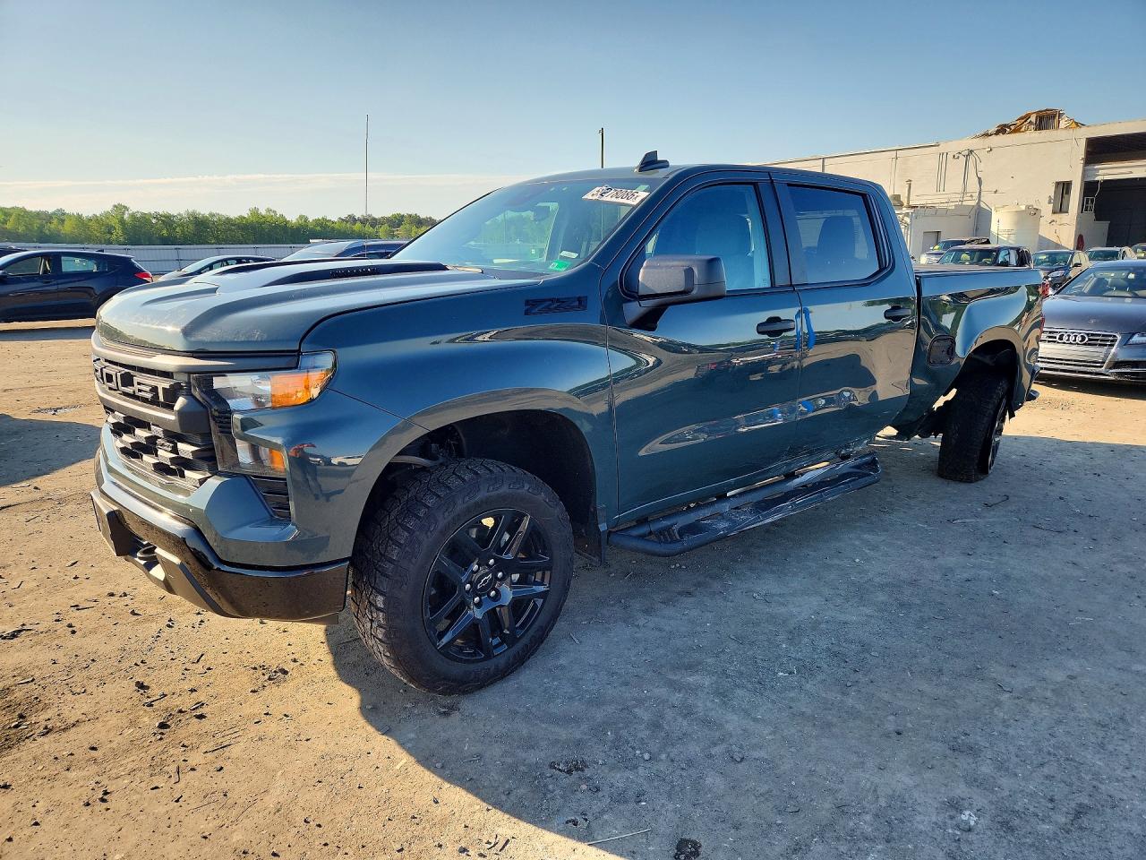 2025 Chevrolet Silverado 1500 Custom Trail Boss, VIN 3GCPKCEK6SG324931 — Зад