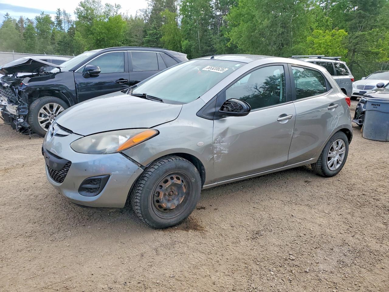 2012 Mazda 2 Sport, VIN JM1DE1KYXC0139083 — Side