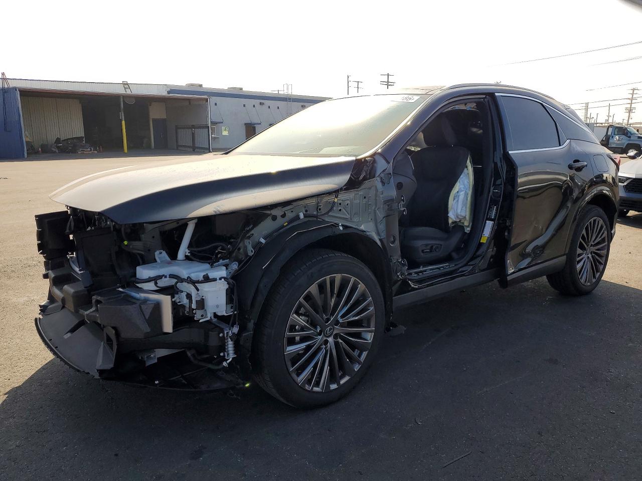 2026 Lexus RX 450h+ Luxury, VIN JTJCJMGA4T2042600 — Front end