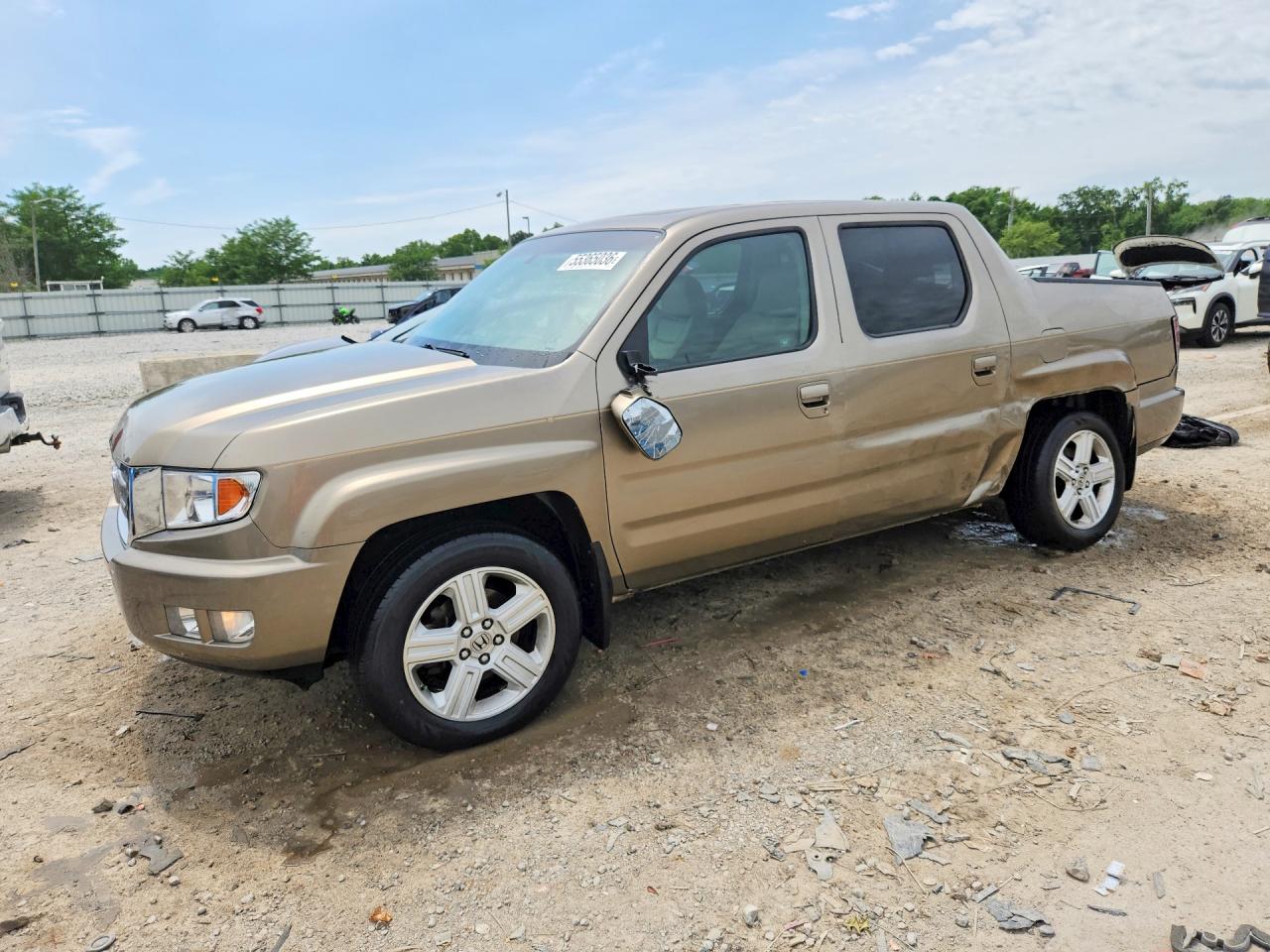 2011 Honda Ridgeline RTL, VIN 5FPYK1F52BB002480 — Side