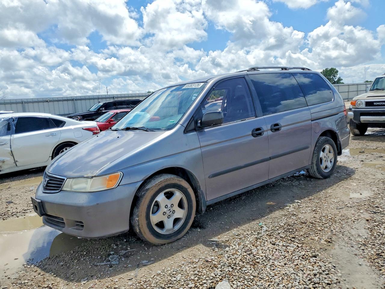 1999 Honda Odyssey LX, VIN 2HKRL185XXH500300 — Side
