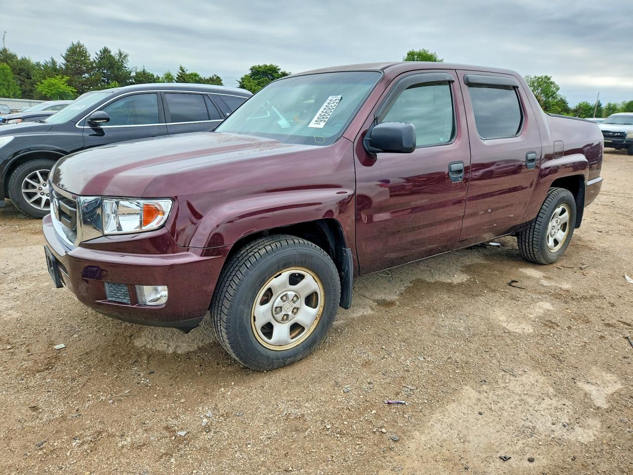 2011 Honda Ridgeline RT, VIN 5FPYK1F25BB003581 — Side