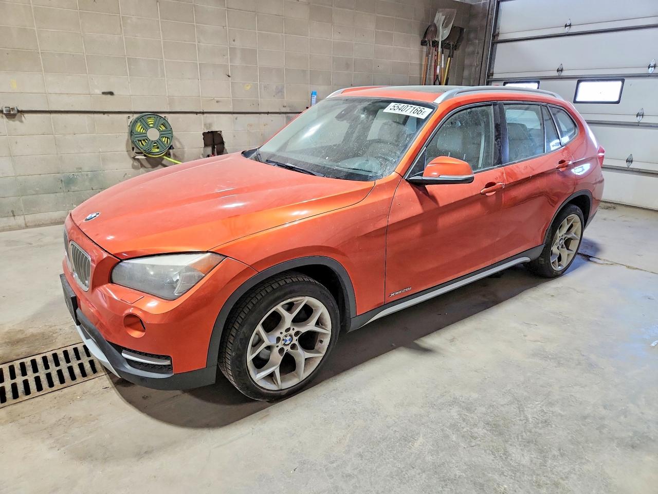 2013 BMW X1 xDrive28i, VIN WBAVL1C5XDVR87383 — Vandalism