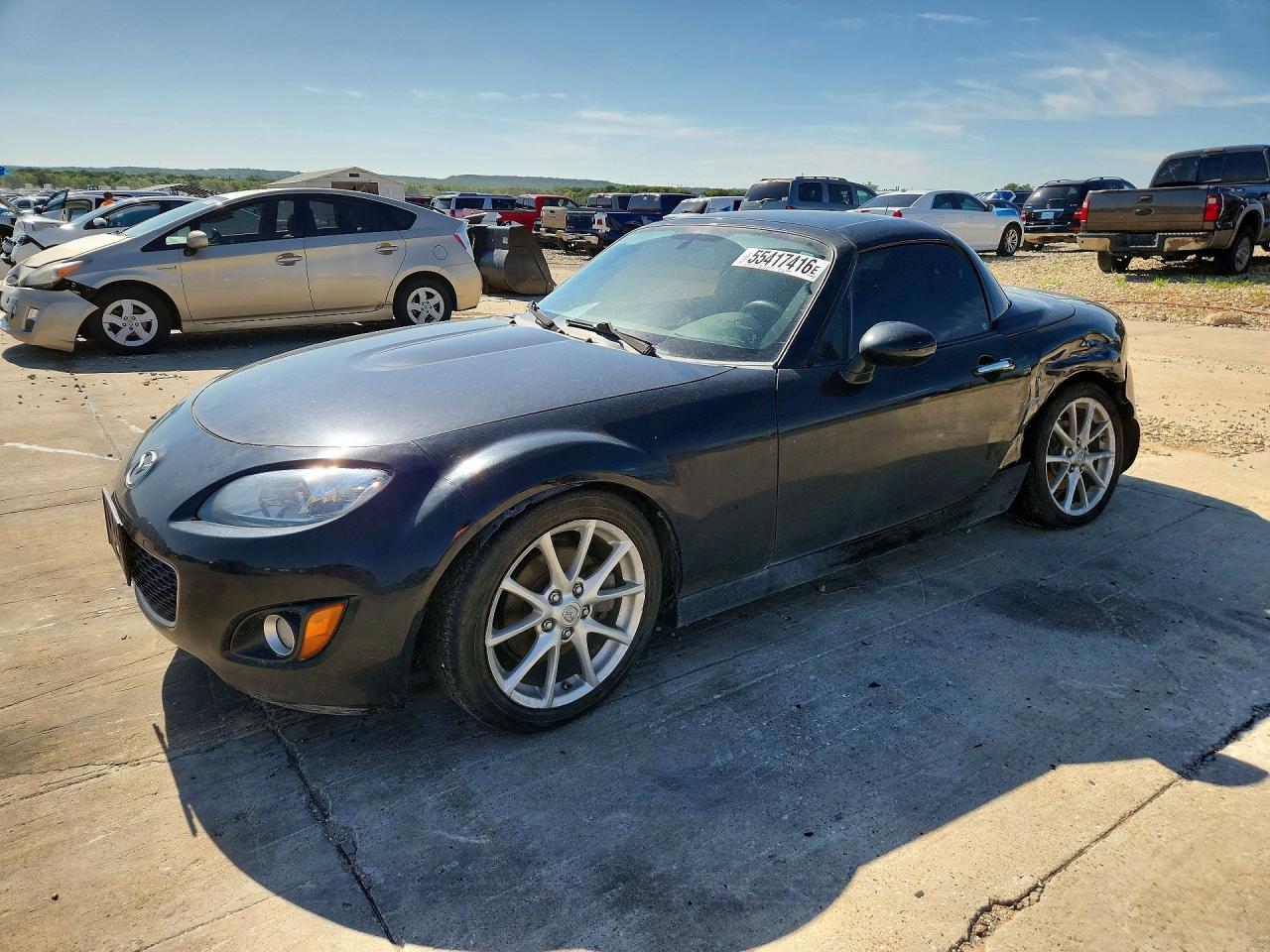 2010 Mazda MX-5 Miata Grand Touring, VIN JM1NC2FF9A0213034 — Side