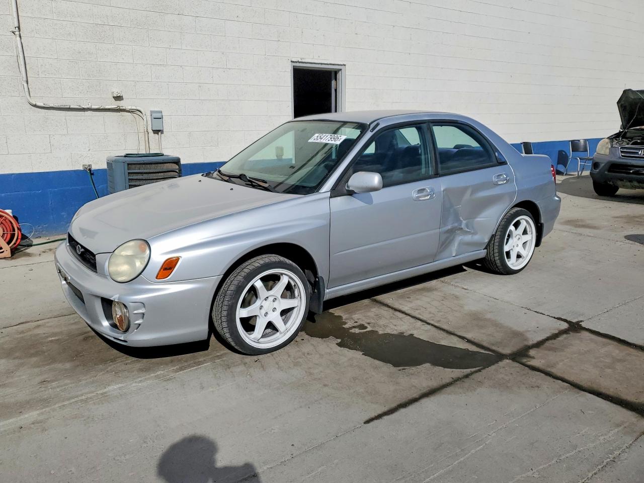 2002 Subaru Impreza RS, VIN JF1GD67592G506143 — Бок