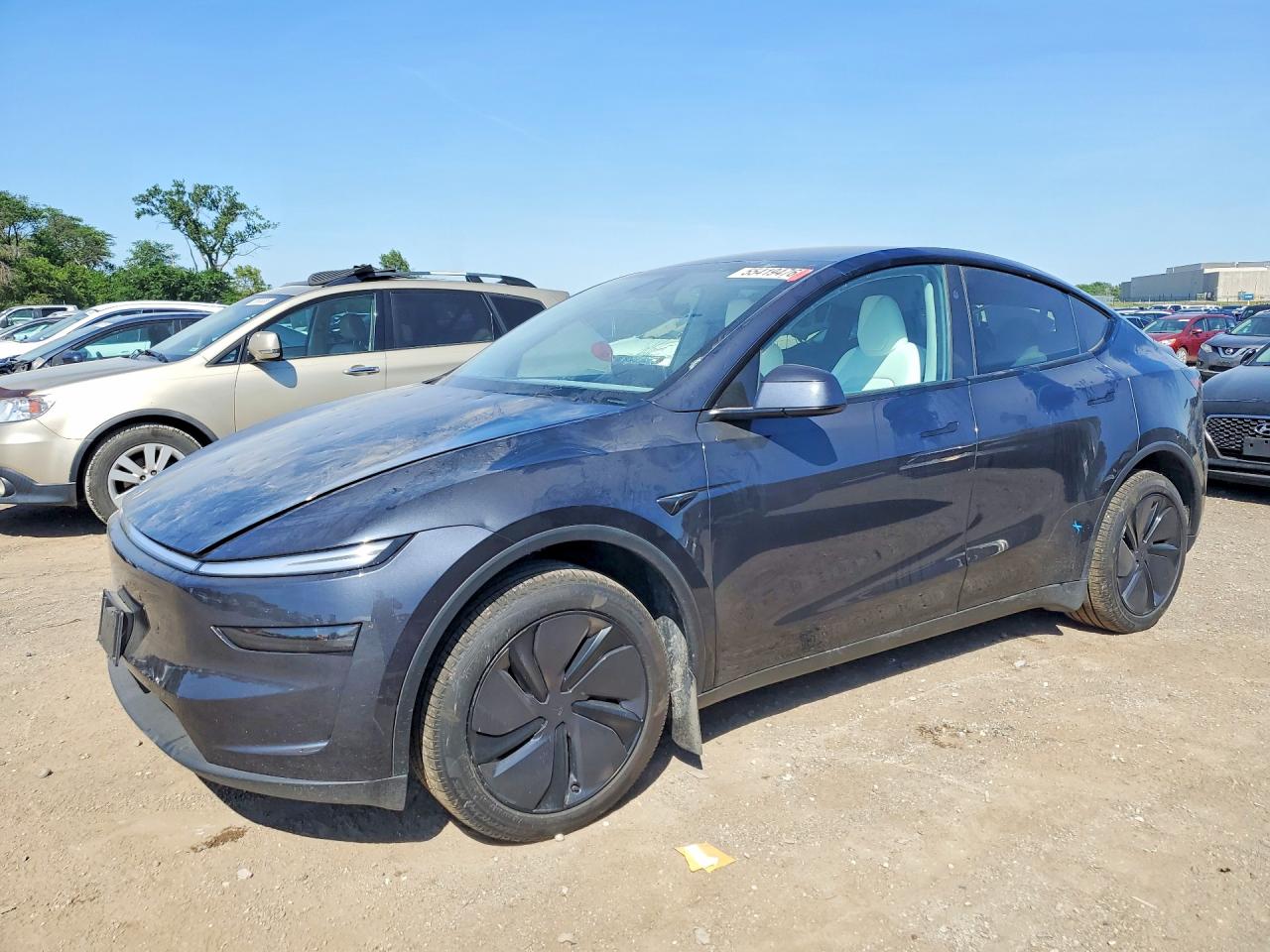 2026 Tesla Model Y Long Range, VIN 7SAYGDED2TA490545 — Град