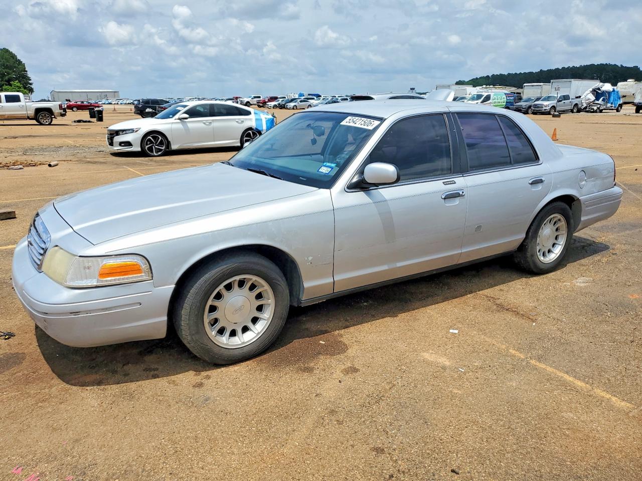 1999 Ford Crown Victoria LX, VIN 2FAFP74W6XX231841 — Rear end