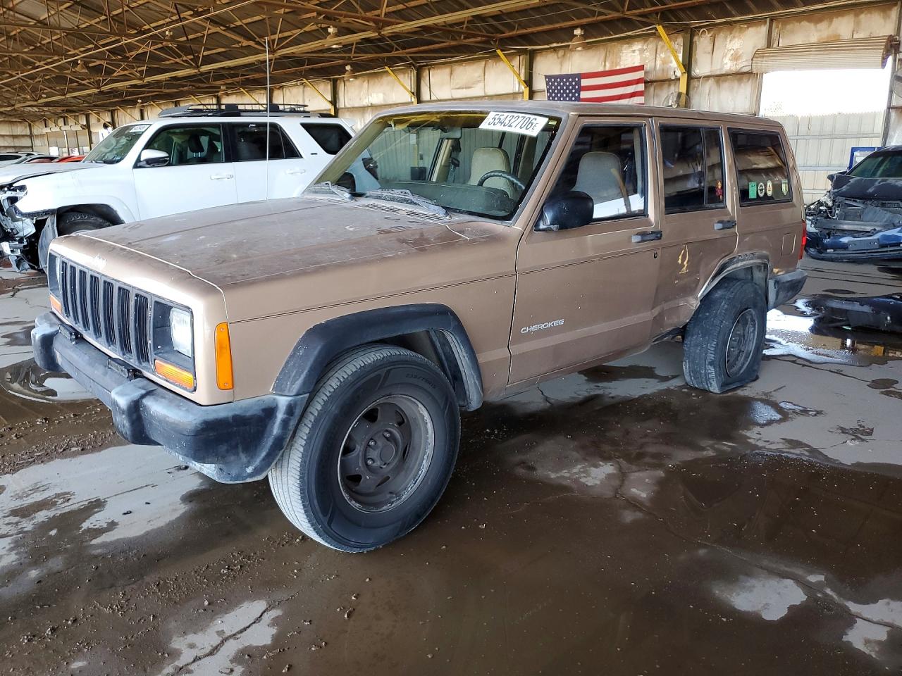 1999 Jeep Cherokee Sport, VIN 1J4FT68S4XL676349 — Side