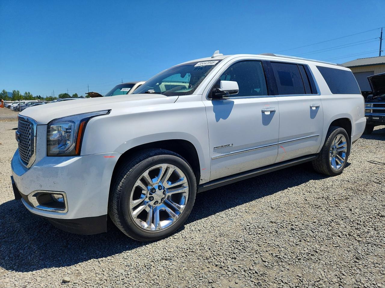 2016 GMC Yukon XL Denali, VIN 1GKS2HKJ6GR276118 — Side