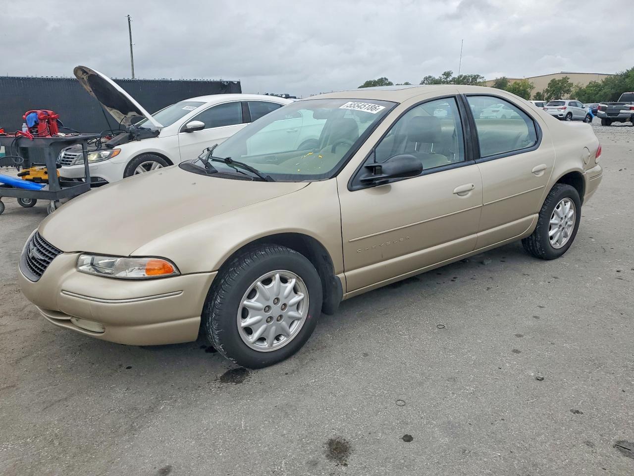 1999 Chrysler Cirrus LXi, VIN 1C3EJ56H0XN643771 — Side