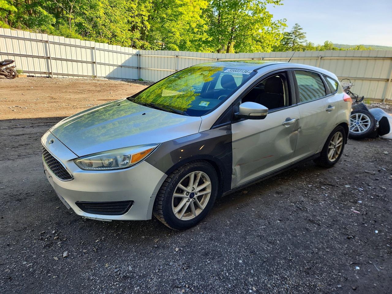 2016 Ford Focus SE, VIN 1FADP3K26GL263637 — Side