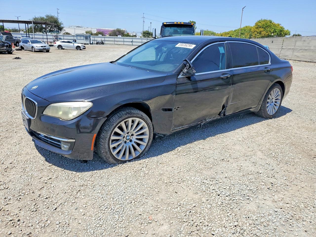 2013 BMW 7 Series 740Li, VIN WBAYE4C52DDW22744 — Side
