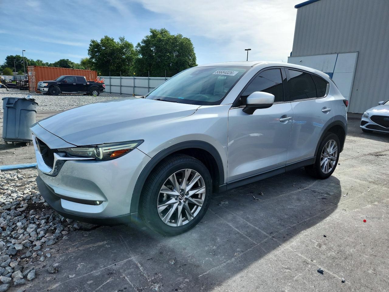 2021 Mazda CX-5 Grand Touring, VIN JM3KFADM3M1358971 — Partial repair