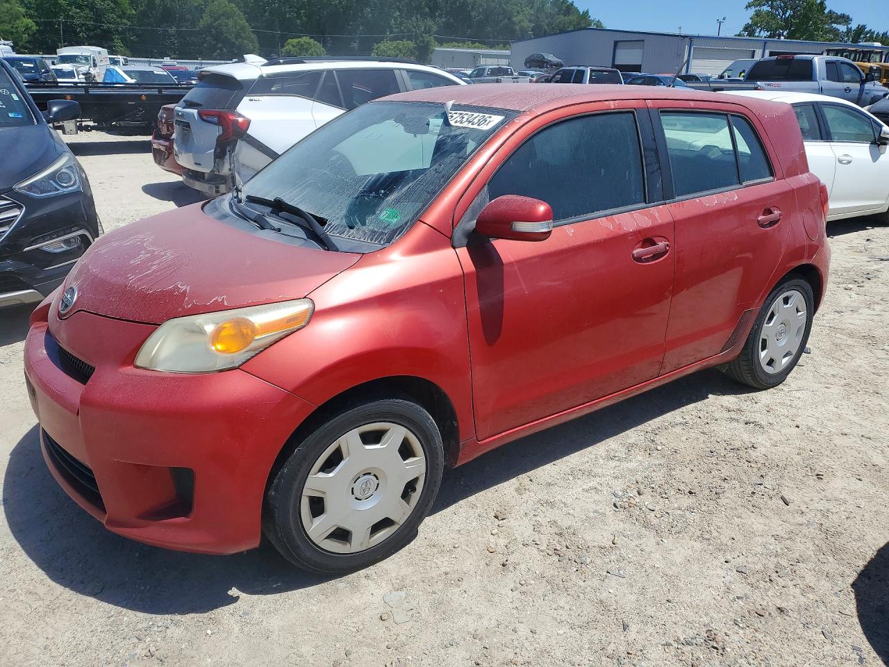 2010 Scion xD, VIN JTKKU4B45AJ052264 — Бок