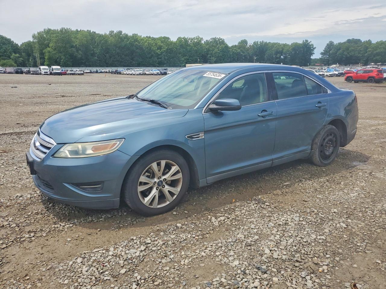2010 Ford Taurus SEL, VIN 1FAHP2EW4AG115545 — Side