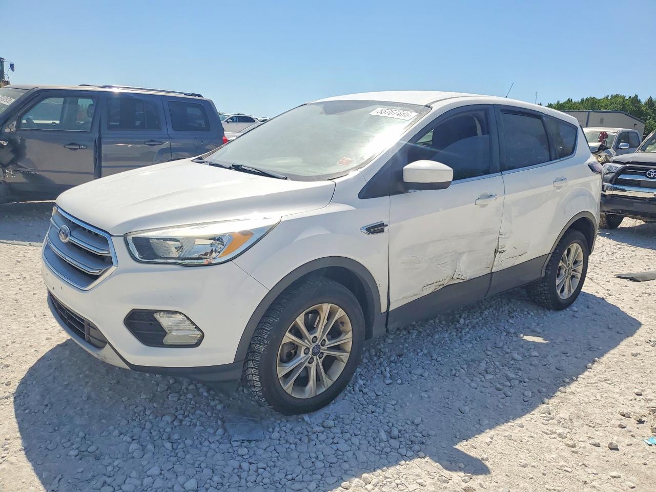2017 Ford Escape SE, VIN 1FMCU9G93HUA24240 — Side