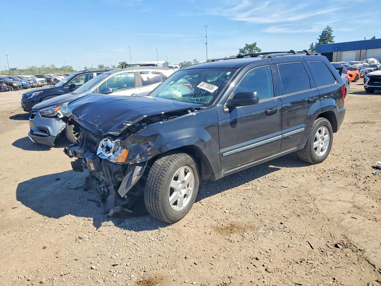 2009 Jeep Grand Cherokee Laredo, VIN 1J8GR48K39C548807 — Front end