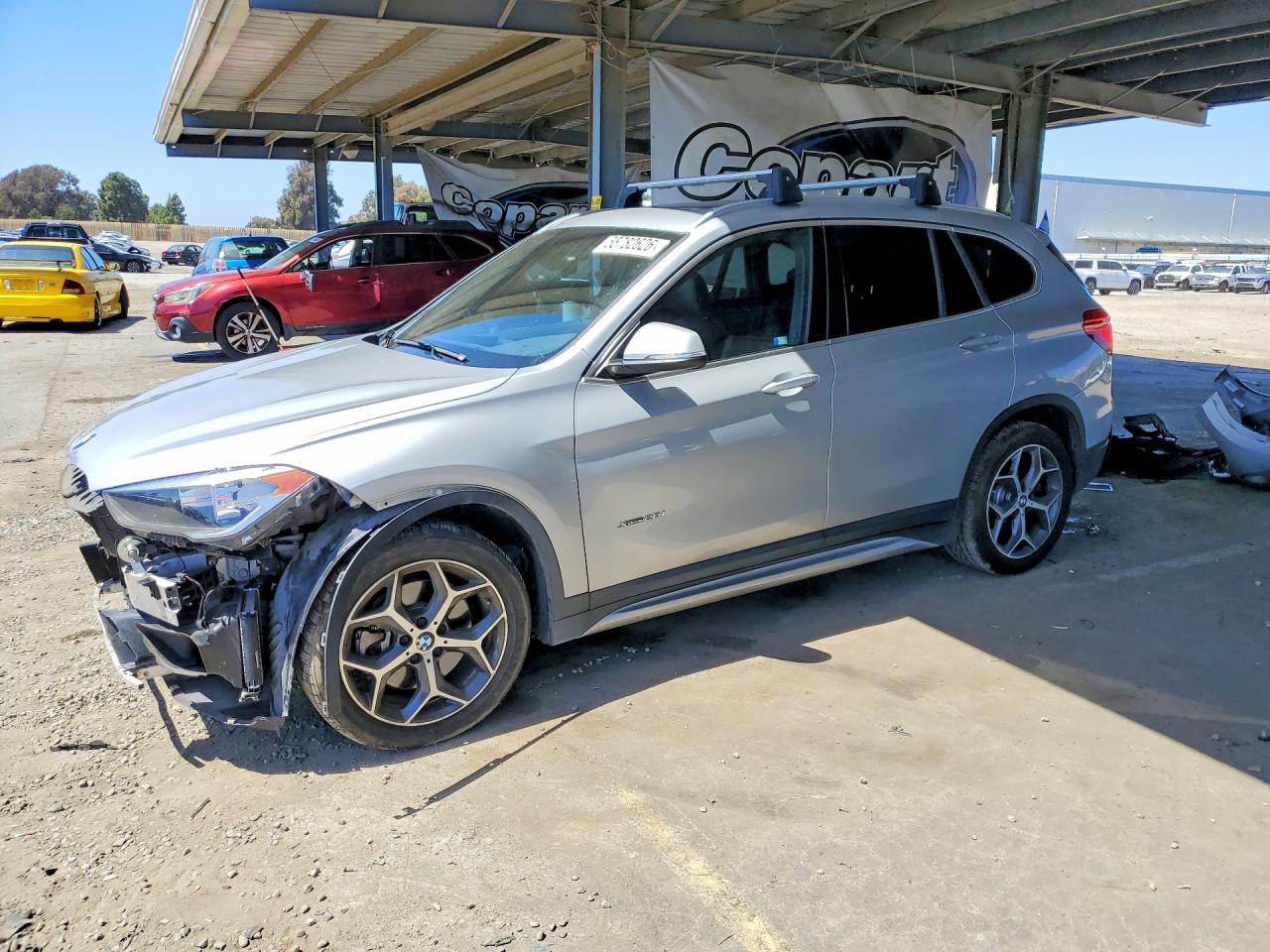 2018 BMW X1 xDrive28i, VIN WBXHT3C33J5K30771 — Front end