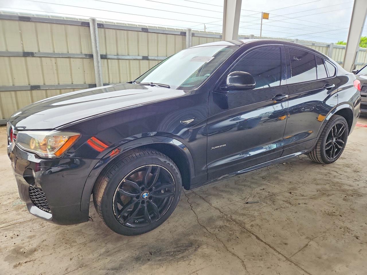 2015 BMW X4 xDrive28i, VIN 5UXXW3C58F0M87509 — Side