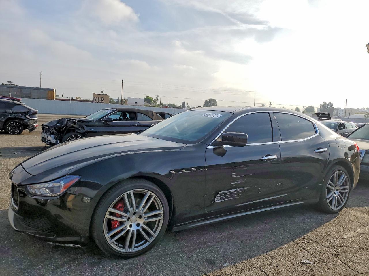 2016 Maserati Ghibli S Q4, VIN ZAM57RTAXG1191453 — Side