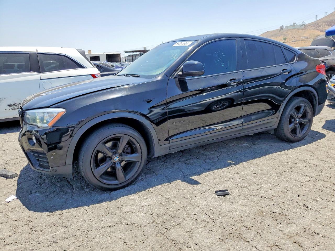 2015 BMW X4 xDrive28i, VIN 5UXXW3C52F0M87389 — Front end