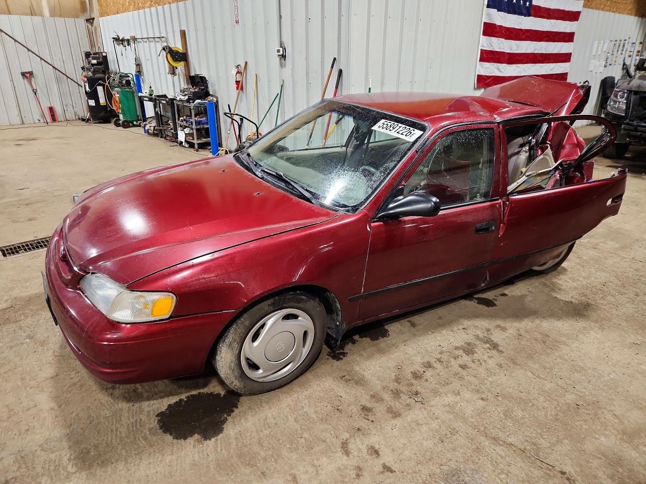 1999 Toyota Corolla CE, VIN 1NXBR12E7XZ234759 — Rear end